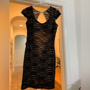 Pretty little open back black shimmer mini dress